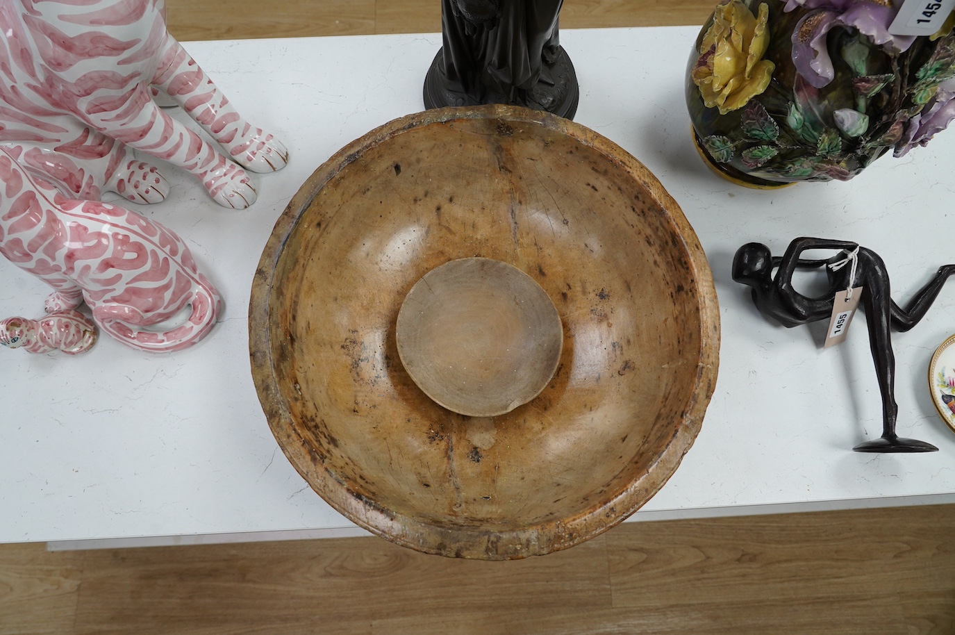 An 18th/19th century sycamore mixing bowl and a smaller bowl, largest 44cm diameter. Condition - poor